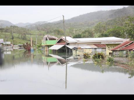 Credit: Photos by Nathaniel Stewart A house in Content stands partially submerged due to rising groundwater.
