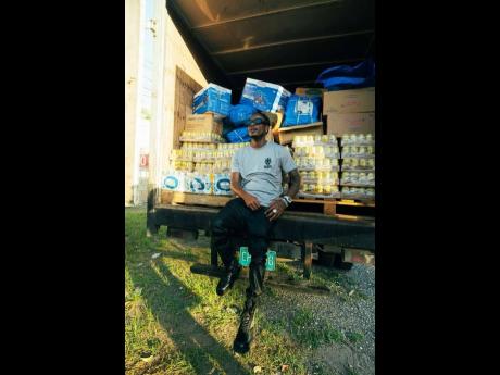 Credit: Contributed Masicka delivering supplies to hurricane victims in St Elizabeth.