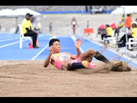 Credit: Photos by Gladstone Taylor/Multimedia Photo Editor Shanieka Ricketts lands in the triple jump pit on her way to claiming the national title at the JAAA/PUMA National Junior and Senior Championships inside the National Stadium.
