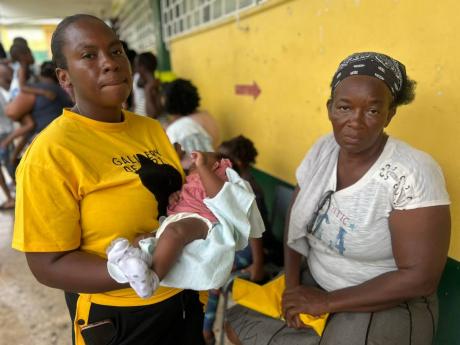 Credit: Mickalia Kington Judith Jarrett with her newborn and her mother Lee Patterson, both from Shrewsbury, Westmoreland, at the hurricane shelter at the Petersfield High School. The family was displaced by Hurricane Melissa.