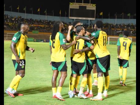 Credit: Gladstone Taylor File
The Reggae Boyz celebrate scoring a goal during their Concacaf World Cup qualifier against Bermuda at the National Stadium last month.