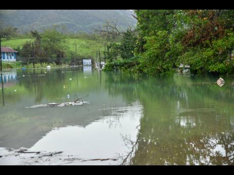 Credit: Photos by Matthew McKoy/Photographer This flooded area of Content, Manchester, is impassible by ‘regular’ means.