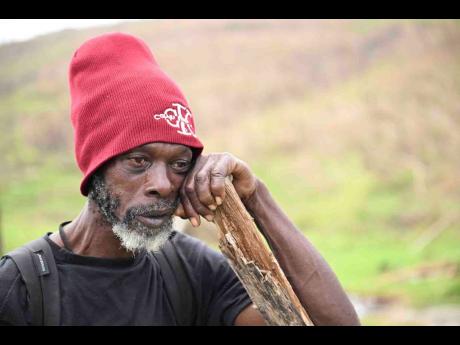 Credit: Ricardo Makyn Esroy Holness weeps as he recounts the devastation left by Hurricane Melissa.