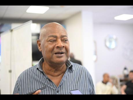 Credit: Ricardo Makyn JFF president Michael Ricketts.