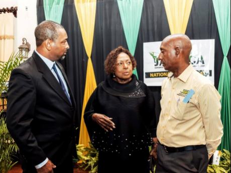 Credit: Contributed From left: Jamaica Track and Field Coaches Association (JATAFCA) President David Riley, Sports Minister Olivia Grange and Jamaica Athletics Administrative Association President Garth Gayle at the 2025 JATAFCA Long Service Awards Ceremony at Alhambra Inn in Kingston on Saturday night.