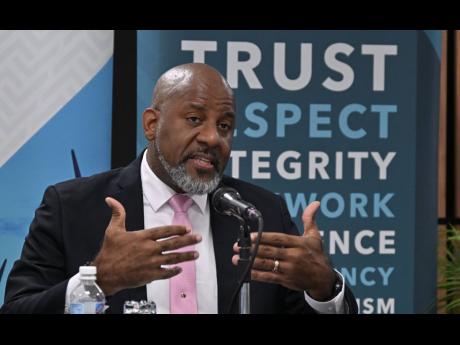 Director General, Planning Institute of Jamaica (PIOJ), Dr Wayne Henry, provides data on the prevalence of poverty, during the PIOJ's hybrid quarterly media briefing on Tuesday (November 25).

