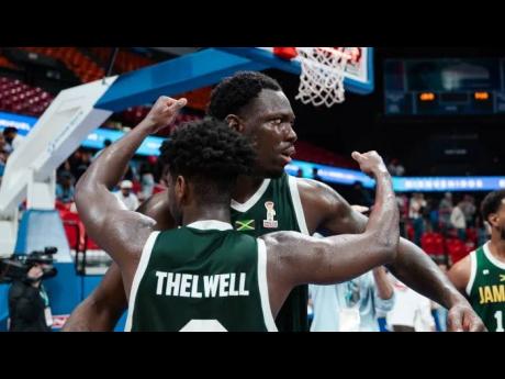 Credit: Courtesy of www.fiba.basketball/en Jamaica’s Andrew Thelwell congratulates Kofi Cockburn after the centre converted a rebound to score the game-winning basket against hosts Puerto Rico in their FIBA World Cup Group B basketball qualification opener 92-90 inside the Coliseo Roberto Clemente in Puerto Rico on Friday.