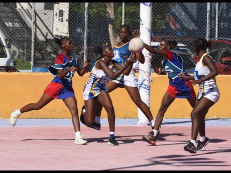 Credit: File Netballers from Camperdown High (red and blue tops) and Gaynstead High battle for the ball during an ISSA urban area match at the Leila Robinson Court in November 2024.