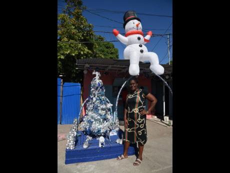 Credit: Ian Allen Keneisha Batson, resident of Payne Land, got her Christmas decorations up early this year.