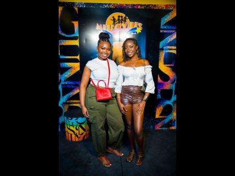 Credit: Contributed Photos Daniela Fagon (left) and Aalliyah Rattray kept things fresh and effortless, rocking casual-chic looks that stood out beautifully against the colourful, high-energy Guinness backdrop at Mas Camp.