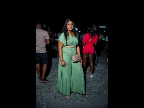 Credit: Contributed Natalie Brown opted for a sage green two-piece set, a soft contrast to the lively Saturday night crowd.