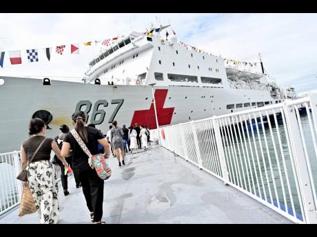 Credit: Rudolph Brown/Photographer Members of Jamaica Guangdong Association tour the Silk Road Ark at the Port Royal Cruise Terminal on Monday.