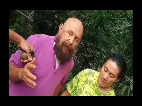 Credit: Contributed Screen shot shows husband and wife being held by abductors armed with guns and a grenade and demanding US$2.5 million ransom