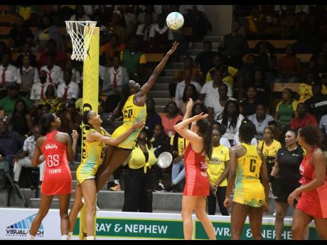 Sunshine Girls goal defence Jodian Ward (third left) rises to challenge a shot by England Vitality Roses’ goal attack Lois Pearson (third right) during game three of the Horizon Netball Series at the National Indoor Sports Centre on November 25, 2024. Reacting to the action are England’s Helen Housby (left) and Sunshine Girls’ Shamera Sterling-Humphrey (second left). Jamaica won 50-49. 