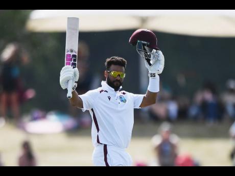 Credit: AP West Indies’ Shai Hope celebrates after reaching a century against New Zealand on Day Four of the first Test in Christchurch.