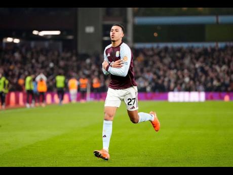 Aston Villa’s Morgan Rogers celebrates after scoring his side’s second goal during the English Premier League soccer match against Manchester United, in Birmingham, England, on Sunday. Villa won  2-1.
