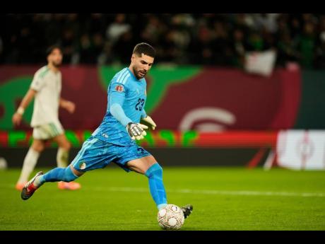 Algeria’s goalkeeper Luca Zidane  kicks the ball during the Africa Cup of Nations group E soccer match against Burkino Faso in Rabat, Morocco, on Sunday.
