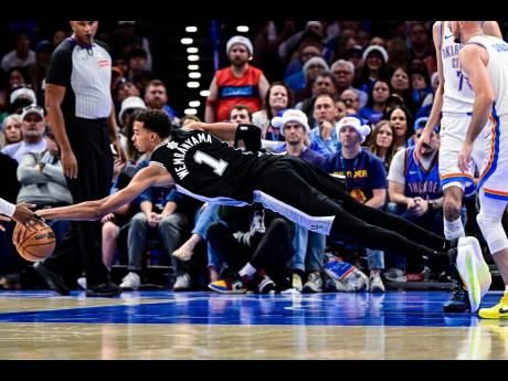 Credit: AP San Antonio Spurs forward/centre Victor Wembanyama (1) dives for the free ball.