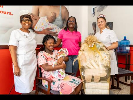 From left: Sister Mendis Dennis Vincent, first-time mother Sharrisa Gaynor, Sudesh Roberts, marketing coordinator at Massy Distribution Jamaica Limited, and registered nurse midwife Lisbe Ortega celebrate with Baby Jergens inside the breastfeeding room at the Victoria Jubilee Hospital.