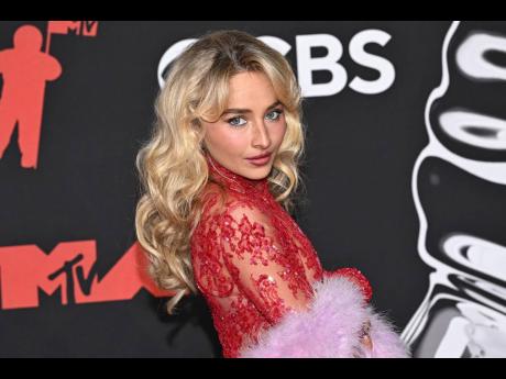 Credit: AP Sabrina Carpenter