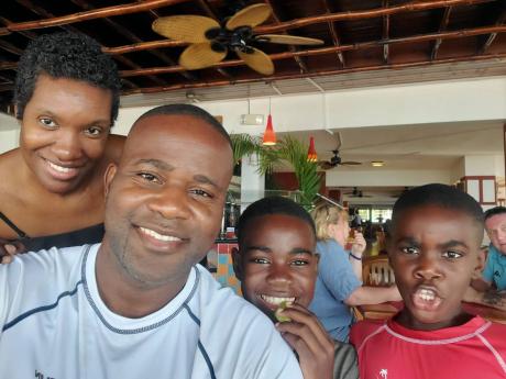 Melissa Bernard-Hines (left) with her sons and husband.