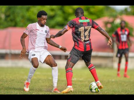 Credit: File Damoi Whitfield (left) of Chapelton Maroons in action against Fabian Reid of Arnett Gardens during a Jamaica Premier League match at Turner’s Oval, Clarendon on September 14, 2025.