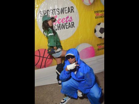 Credit: Anthony Minott New York fashionistas Nancy Couture (stooping) and Sariah Darden are ready for the party.