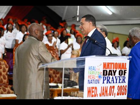 Prime Minister Dr Andrew Holness (right) greets Founder of Power of Faith Ministries International, Bishop Dr Delford Davis, during the ‘Heal the Family, Heal the Nation’ Day of Prayer service on Wednesday, January 7, 2026. The service was held at the Power of Faith Ministries in Portmore, St Catherine under the theme ‘Reunite and Build the Family with Love and Forgiveness’, coinciding with the sixth Annual National Day of Prayer.