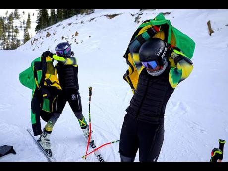Sisters Henniyah Rivers (left) and Helaina Rivers put on their jackets during training in the slalom on Wednesday, December 10, 2025, at Loveland Ski Area in Dillon, Colorado. 
