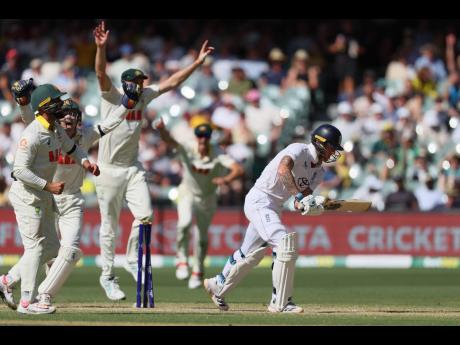 Credit: AP Australian players celebrate after England’s Ben Stokes (right) was dismissed during play on day four of the third Ashes cricket Test.