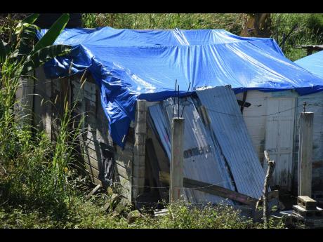 The house of Norman Spence suffered serious damage during Hurricane Melissa. 