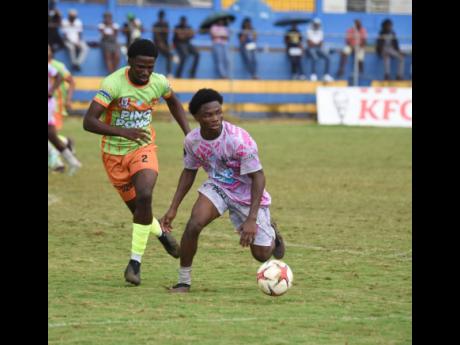 All-Manning’s Kimarly Scott (right) shields the ball from All-daCosta’s Orane Gayle during the ISSA All-daCosta versus All-Manning playoff match at the St Elizabeth Technical Sports Complex  on Saturday, January 10, 2026.