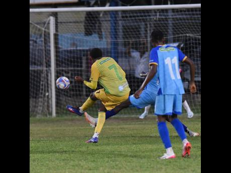 Karim Bryan (left) of Treasure Beach FC curls the ball towards goal during their Jamaica Premier League match against Molynes United at the Drewsland Mini Stadium yesterday. 