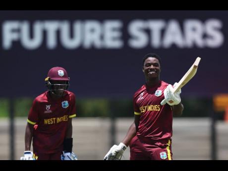 Credit: Courtesy of ICC West Indies U19 batsman Shamar Apple (right) celebrates a century against Japan, while Tanez Francis, who also scored a century, looks on during an ICC U19 Cricket World Cup warm-up game at the United Cricket Ground in Windhoek, Namibia, yesterday.
