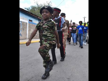 Credit: Ian Allen In this 2023 photo, August Town children show the next generation it’s all about community pride. August Town recorded zero murders in 2025.
