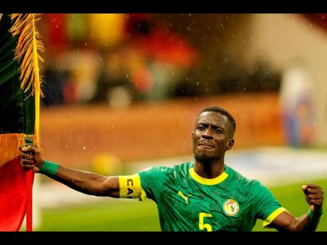 Senegal’s Idrissa Gueye celebrates after winning the Africa Cup of Nations final match against Morocco in Rabat, Morocco, yesterday.