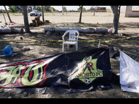 Credit: AP Crime scene tape surrounds a soccer field on Monday, the day after gunmen opened fire, killing and wounding people, in Salamanca, Mexico.