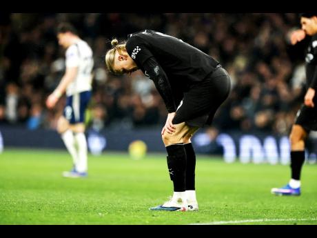 Credit: AP Manchester City’s Erling Haaland reacts during the English Premier League soccer match against Tottenham Hotspur in London on Sunday.