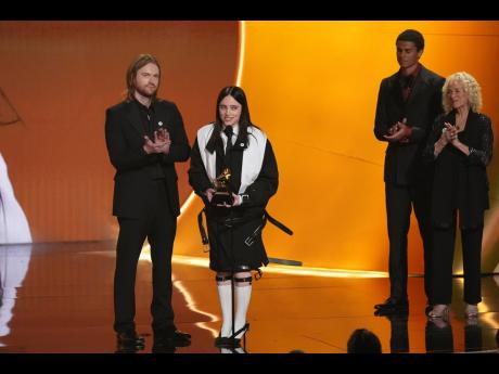 Finneas (left) and Billie Eilish accept the award for song of the year for ‘Wildflower’.