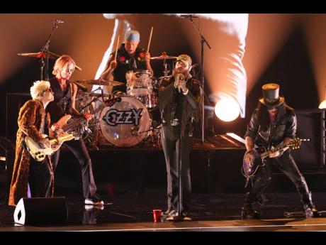 From left: Andrew Watt, Duff McKagan, Chad Smith, Post Malone and Slash perrform ‘War Pigs’ during the in memoriam tribute. (AP Photo/Chris Pizzello)