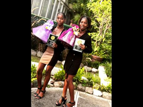  Crystel (left) and Crystal Thomas show off their awards.