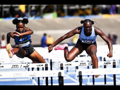 Hydel High School’s Jody-Ann Daley is locked in a heated battle with Edwin Allen’s Santae Wilson during the girl’s Class One 100 metres hurdles at the Youngster Goldsmith track meet at the National Stadium on Saturday, February 1, 2025. Daley won in 13.64 seconds ahead of Wilson, who clocked 13.68 seconds. This year’s staging of the Youngster Goldsmith meet will be the first of the season inside the National Stadium.