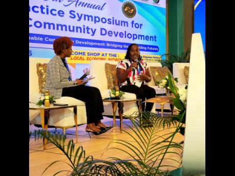 Taneka Stewart-Blake (right), former inmate at the South Camp Adult Correctional Centre, tells her story of transformation during the recent Planning Institute of Jamaica Best Practice Symposium held at The Jamaica Pegasus hotel in New Kingston. Listening is interviewer Rochelle Whyte.  
