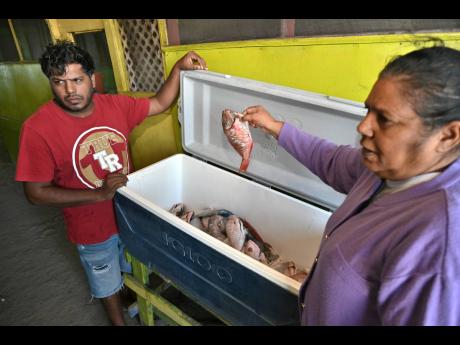 Credit: Rudolph Brown Photos Operators of Aunt Merl Restaurant at Hellshire in St Catherine.