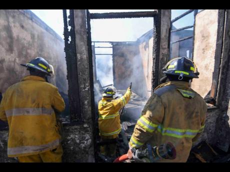 Once a home filled with life and work, the Alton Villa Road building now stands scorched and empty after being destroyed by fire yesterday.