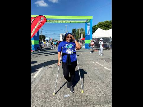 Tameika Gordon-Clarke at the finish line of the Sagicor Sigma Run on Sunday.