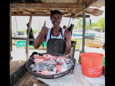 Parri, a fish vendor at Forum Fishing Village in St Catherine, shares insights on shifting consumer preferences.