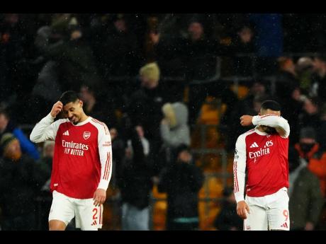 Credit: AP Arsenal’s Gabriel Jesus (right) and William Saliba react during the English Premier League soccer match against Wolverhampton Wanderers in Wolverhampton, England, on Wednesday.