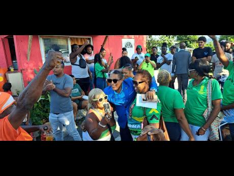 Credit: Photo by Gareth Davis Sr Supporters of Dr Norman Dunn surround him at the opening of the Belfield Community Health Centre on Thursday.