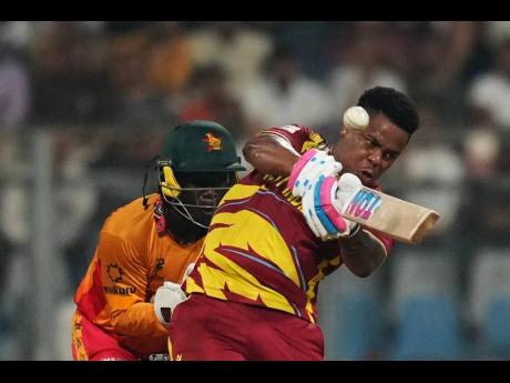 Credit: AP West Indies’ Shimron Hetmyer hits a six during the T20 World Cup cricket match between Zimbabwe and West Indies in Mumbai, India, on Monday.